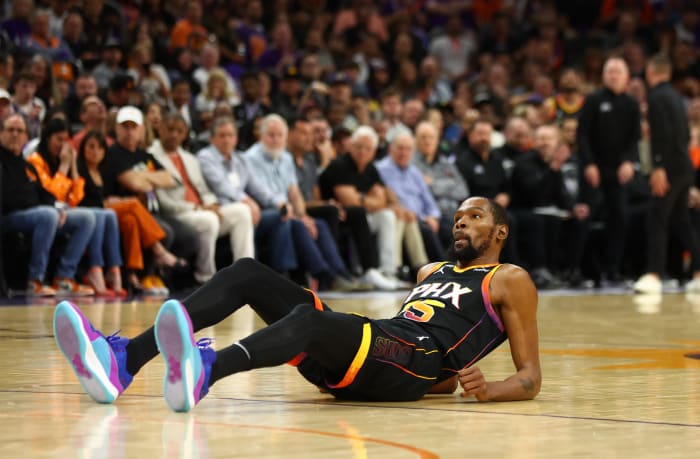 Phoenix Suns forward Kevin Durant falls to the court during a game.